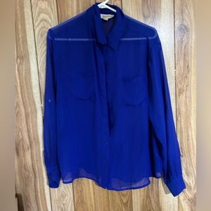 Sheer royal blue button blouse.
